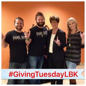 Marsha Sharp Putting her "Guns" up with the Hamil Bros and Cassie Johnston from Giving Tuesday.