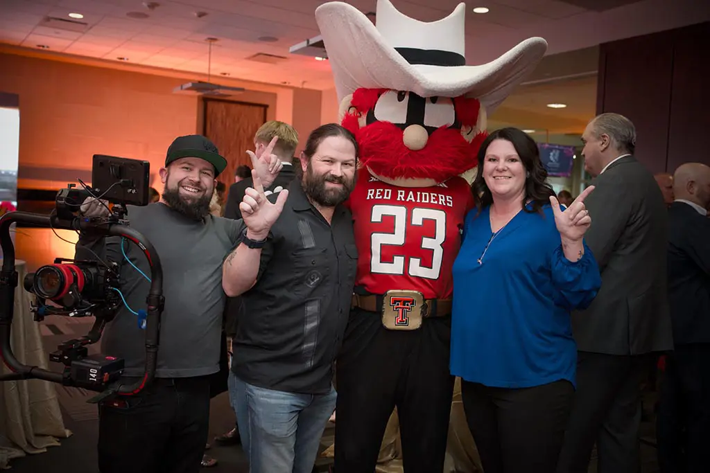 Hamil Bros Studios Sneaking a photo with Raider Red while producing the Rawls College 25th Anniversary Video